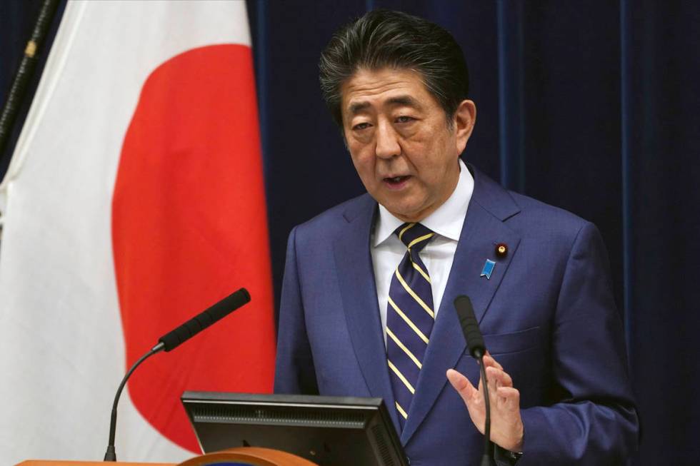 Japanese Prime Minister Shinzo Abe delivers his speech about the coronavirus situation in Japan ...