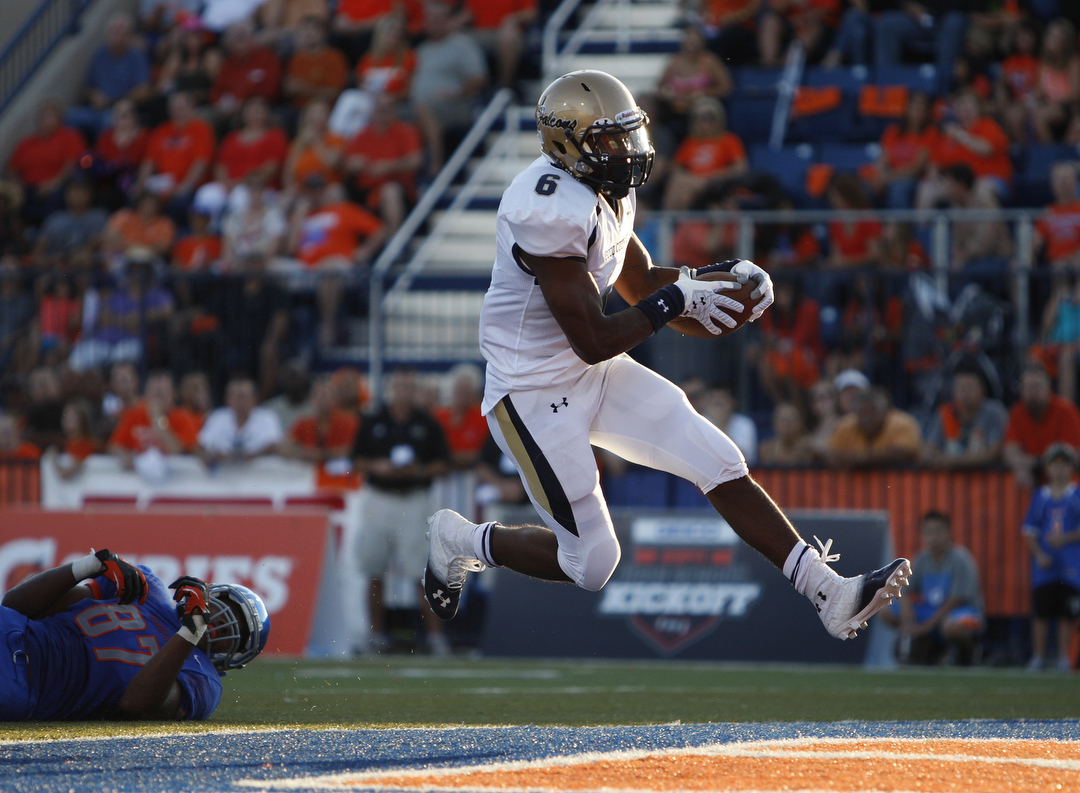 Dorian Odaniel of Our Lady of Good Counsel High School runs into the end zone to score a tou ...