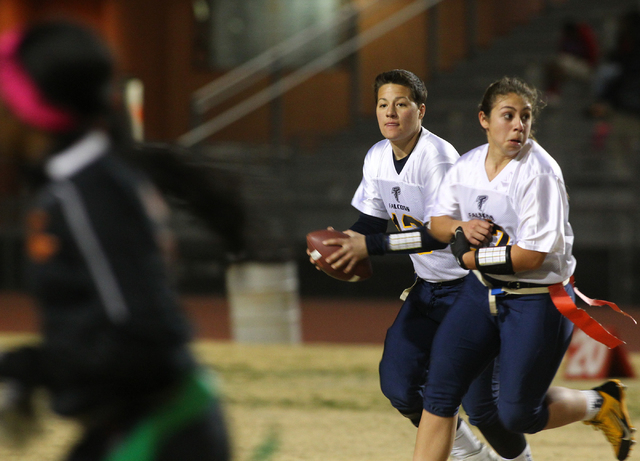 Foothill quarterback Sam Fennell (13) runs with the ball before throwing a pass while playin ...