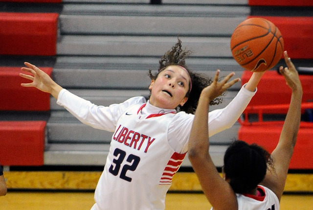 Liberty’s Jazmin O’Bannon (32) grabs a rebound against Coronado during a girls h ...