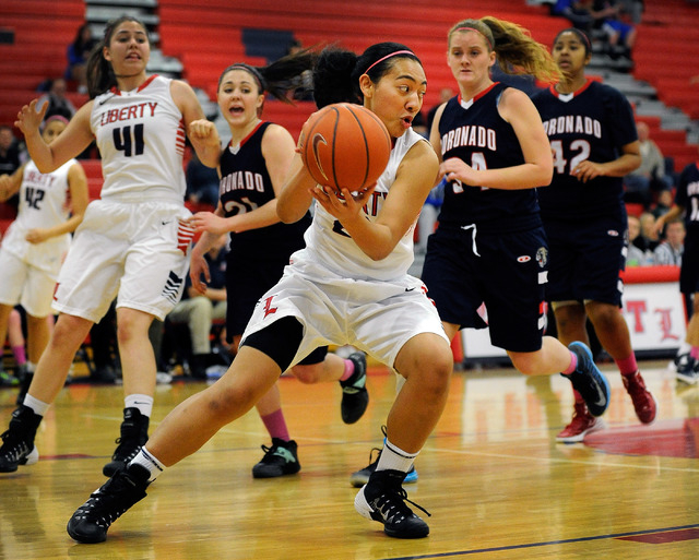 Liberty’s Ahlia Tai grabs a rebound as Liberty’s Nancy Caballero (41), Coronado& ...