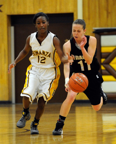 Desert Oasis’s Ashlynn Sharp (11) steals the ball from Bonanza’s Acacia Williams ...