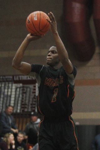 Mojave’s Melvin Irvey (1) shoots a 3-point shot against Faith Lutheran on Thursday. Ir ...