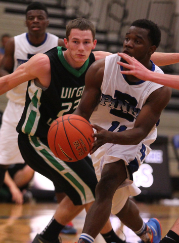 Desert Pines’ Malik Davis (11) gets past Virgin Valley’s Dee Bowler (23) on Frid ...