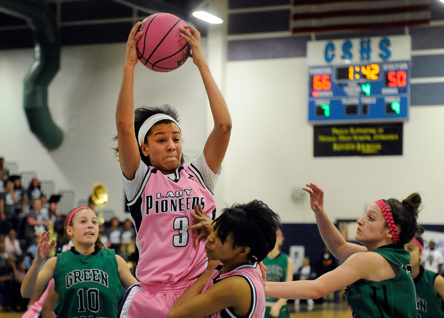 Canyon Spring’s Cherise Beynon (3) grabs a rebound over teammate Erica Jefferson as Gr ...