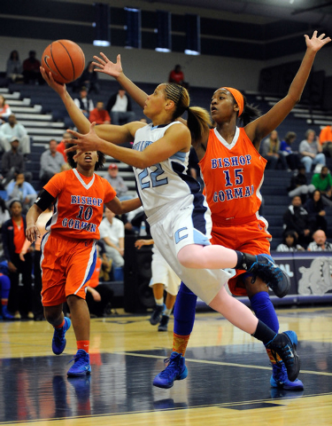 Centennial’s Teirra Hicks (22) shoots as Bishop Gorman’s Maddison Washington (15 ...