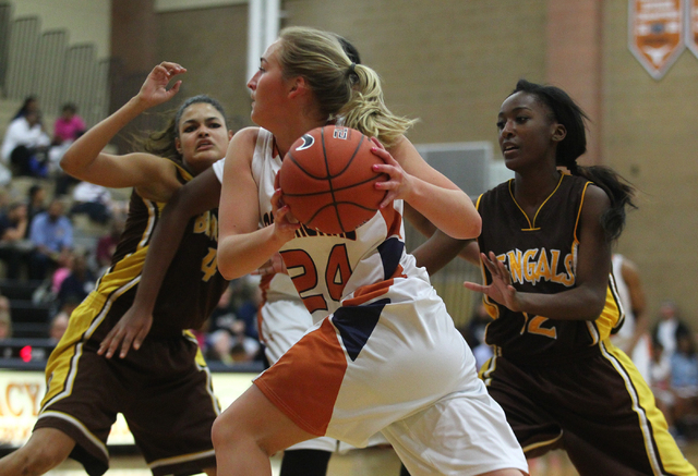 Legacy’s Carolina Rahkonen (24) drives to the basket past Bonanza’s Acacia Williams, rig ...