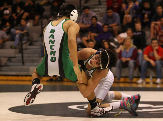 Green Valley’s Jesse Gabriel, right, pull’s down Rancho’s Kyle Penalosa du ...