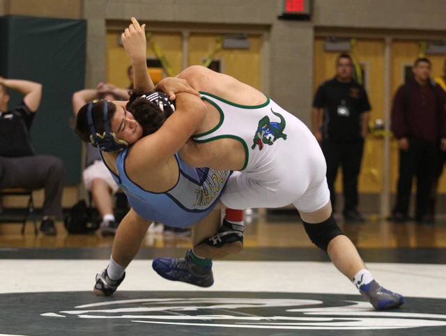 Foothill’s Joshua Ozuna, left, takes down Green Valley’s Logan Hughes during the ...