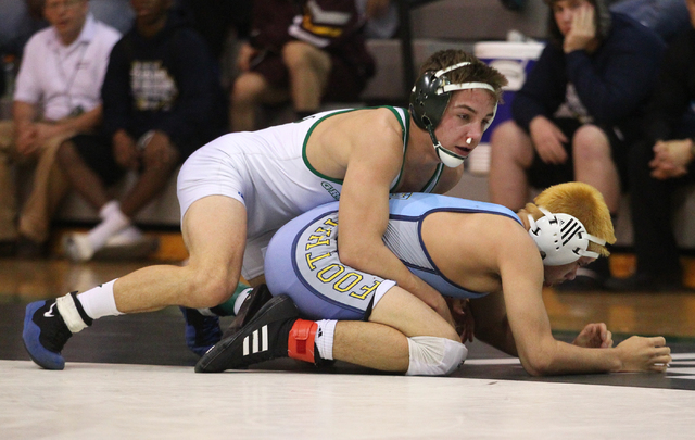 Green Valley’s Jared Brathor holds down Foothill’s Jacob Chavez during the 132-p ...