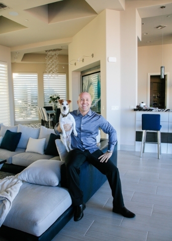 Sports agent Brian Fettner and his Jack Russell Terrier, Maverick, live in a $4 million custom home in Henderson‘s MacDonald Highlands. ELKE COTE/REAL ESTATE MILLIONS
