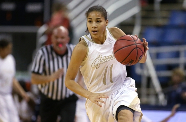 Spring Valley‘s Kayla Harris brings the ball up the court against Faith Lutheran in th ...