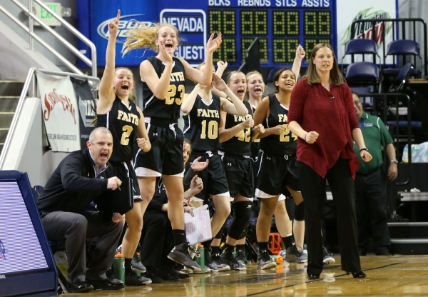 Faith Lutheran celebrates a 3-pointer against Spring Valley in the NIAA Division I-A state b ...