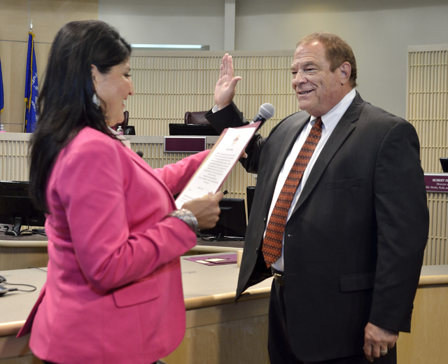 Rodney Burr, right, is sworn in as municipal judge by City Clerk Sabrina Mercadante at Henderson City Hall at 240 S. Water St. in Henderson on Tuesday, May 17, 2016. Bill Hughes/Las Vegas Review-J ...