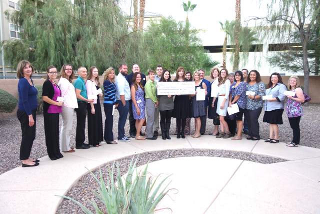 Teachers receive grants from the Junior League of Las Vegas at the Morelli House Oct. 17, 2016. Diane Taylor/Special to View