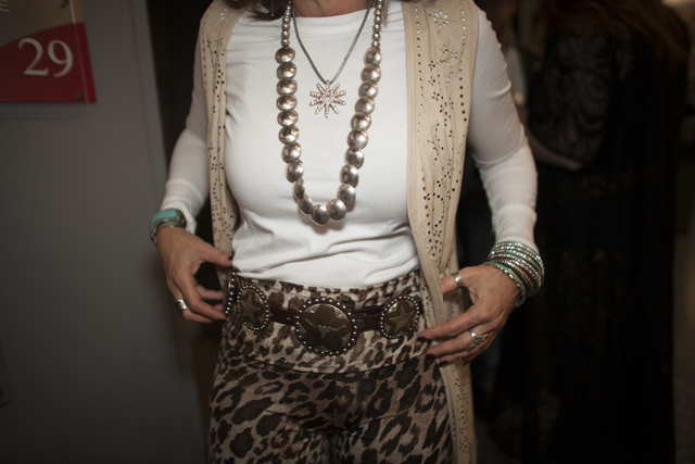 Kathy T. shows off her belt at the National Finals Rodeo at Thomas & Mack Center on Sunday, ...