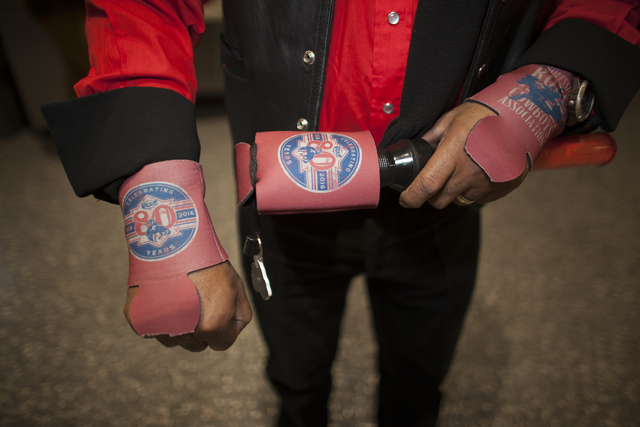 Huntington Banes shows off his beer koozies at the National Finals Rodeo at Thomas & Mack C ...