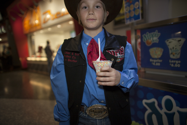 Jake Beutler shows off his vest and shirt combo at the National Finals Rodeo at Thomas & Ma ...