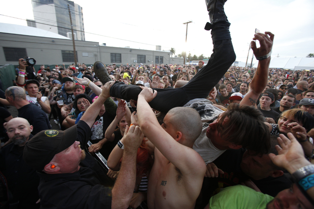 A man crowdsurfs as Subhumans play at Punk Rock Bowling in Las Vegas on Monday, May 27, 2013. ( ...