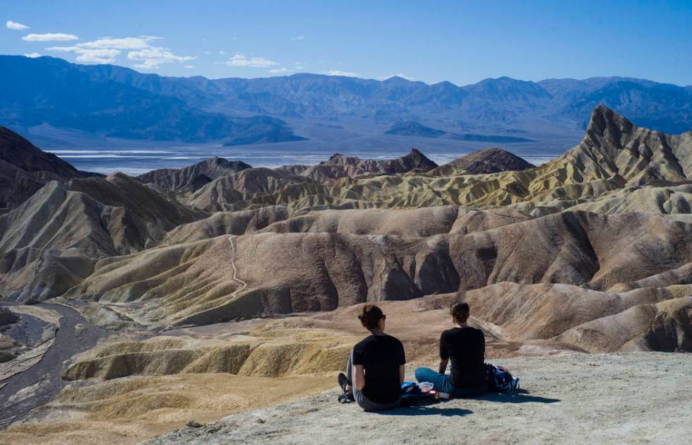 People at Zabriskie Point in Death Valley National Park on Tuesday, Feb. 28, 2017. The cover ar ...