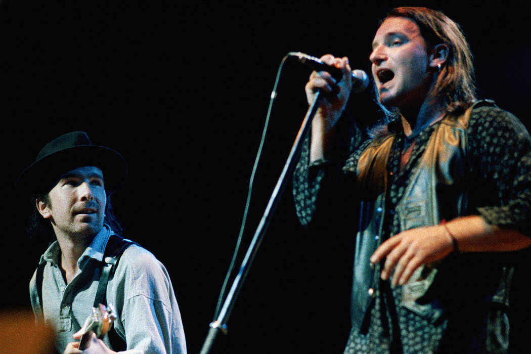 Bono, lead singer of the rock band U2 and The Edge (left) opened their world tour, April 3, 1987, before a sold out crowd at the Activity Center on the campus of Arizona State University in Tempe. ...
