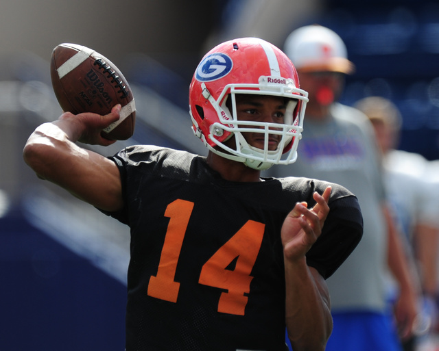 Bishop Gorman quarterback Dorian Thompson-Robinson passes during practice at Bishop Gorman H ...