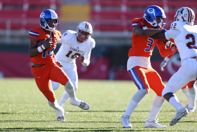 Bishop Gorman’s Dorian Thompson-Robinson (14) runs the ball against Liberty in the Cla ...