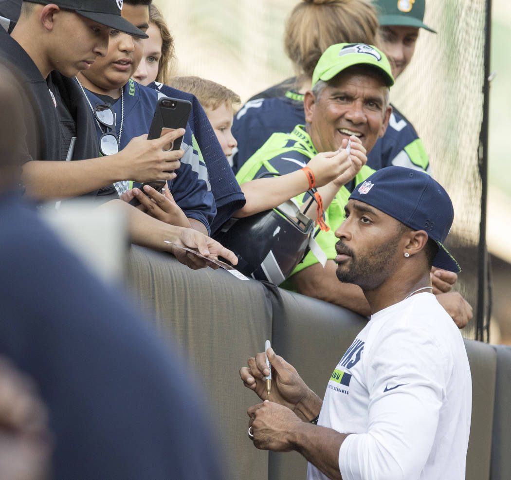 Seattle Seahawks wide receiver Doug Baldwin (89) signs autographs prior to a preseason game against the Oakland Raiders in Oakland, Calif., Thursday, Aug. 31, 2017. Heidi Fang Las Vegas Review-Jou ...