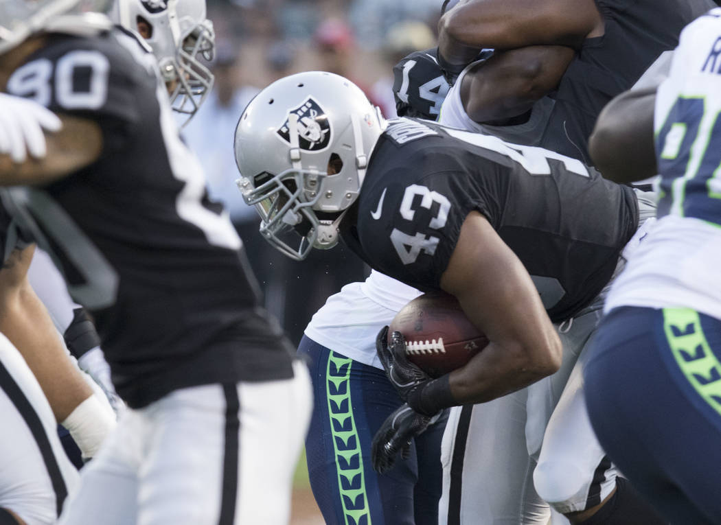 Oakland Raiders running back John Crockett (43) carries the ball in the first half of the preseason game against the Seattle Seahawks in Oakland, Calif., Thursday, Aug. 31, 2017. Heidi Fang Las Ve ...
