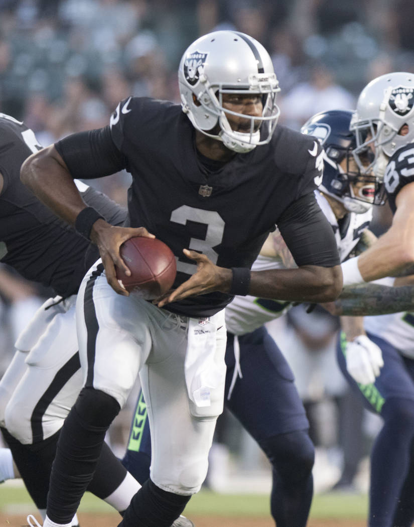 Oakland Raiders quarterback EJ Manuel (3) prepares to throw the ball in the first half of their preseason game against the Seattle Seahawks in Oakland, Calif., Thursday, Aug. 31, 2017. Heidi Fang  ...