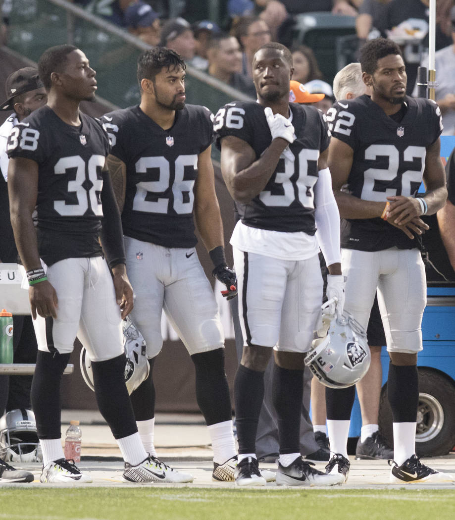Oakland Raiders strong safety T.J. Carrie (38), safety Shalom Luani, defensive back Chris Humes (36) and Oakland Raiders cornerback Gareon Conley (22) on the sideline during the first half of thei ...