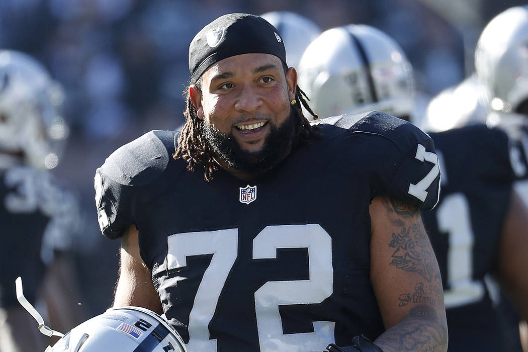 Oakland Raiders tackle Donald Penn (72) is introduced before an NFL football game against the Indianapolis Colts in Oakland, Calif., Saturday, Dec. 24, 2016. (AP Photo/Tony Avelar)