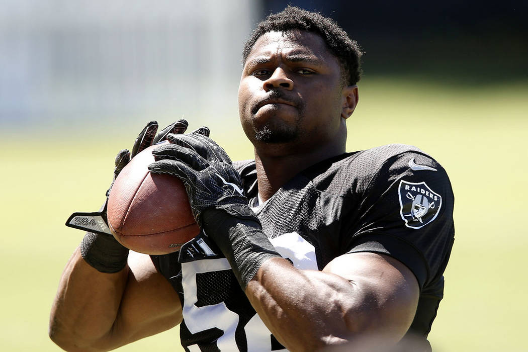 The Oakland Raiders defensive end Khalil Mack prepares to throw the ball during teams practice at Raiders Napa Valley training complex in Napa, Calif., on Monday, July 31, 2017. Bizuayehu Tesfaye  ...