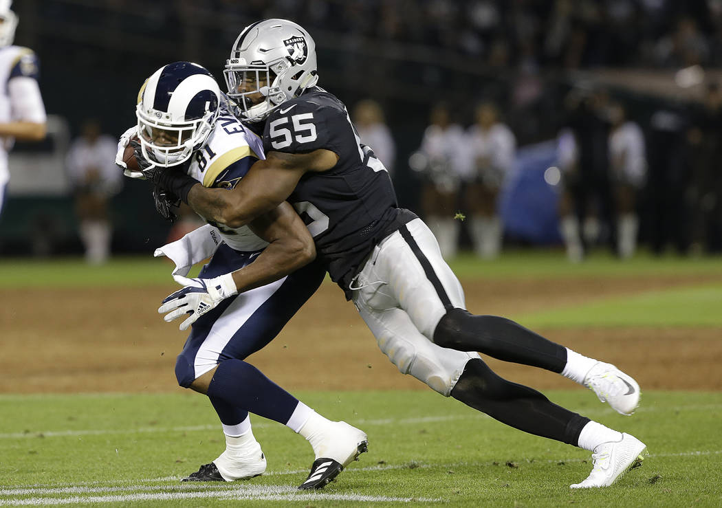 Oakland Raiders linebacker Marquel Lee (55) tackles Los Angeles Rams tight end Gerald Everett during the first half of an NFL preseason football game in Oakland, Calif., Saturday, Aug. 19, 2017. ( ...