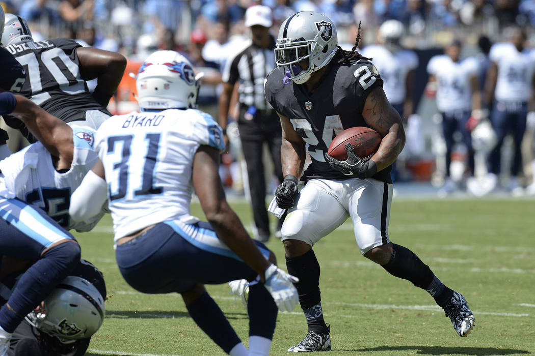 Oakland Raiders running back Marshawn Lynch (24) runs the ball against Tennessee Titans free safety Kevin Byard (31) in the first half of an NFL football game Sunday, Sept. 10, 2017, in Nashville, ...