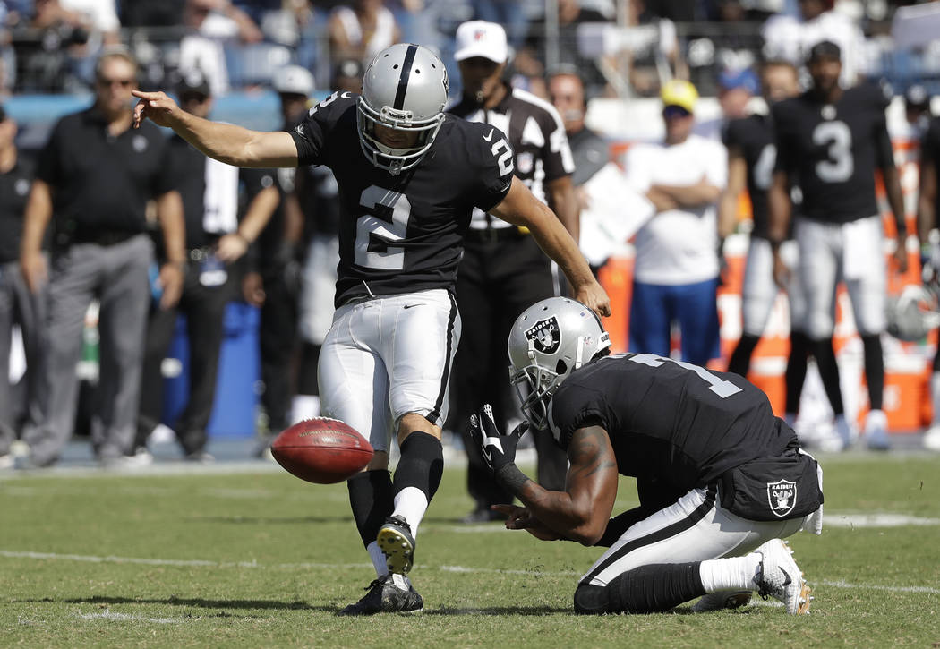 Oakland Raiders kicker Giorgio Tavecchio (2) kicks a 43-yard field goal as Marquette King (7) holds against the Tennessee Titans in the second half of an NFL football game Sunday, Sept. 10, 2017,  ...
