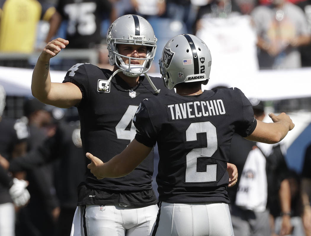Oakland Raiders kicker Giorgio Tavecchio (2) celebrates with quarterback Derek Carr (4) after Tavecchio kicked a a 43-yard field goal against the Tennessee Titans in the fourth quarter of an NFL f ...