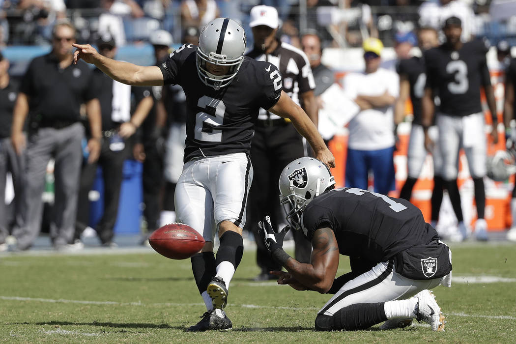 Oakland Raiders kicker Giorgio Tavecchio (2) kicks a 43-yard field goal as Marquette King (7) holds against the Tennessee Titans in the second half of an NFL football game Sunday, Sept. 10, 2017,  ...