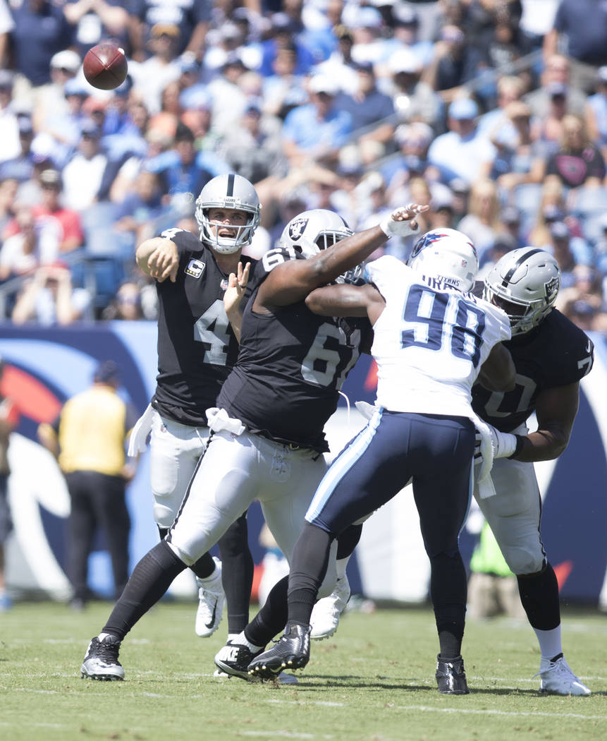 Oakland Raiders quarterback Derek Carr (4) throws the ball in the first half of their game against the Tennessee Titans at the Nissan Stadium in Nashville, Tenn., Sunday, Sept. 10, 2017. Heidi Fan ...