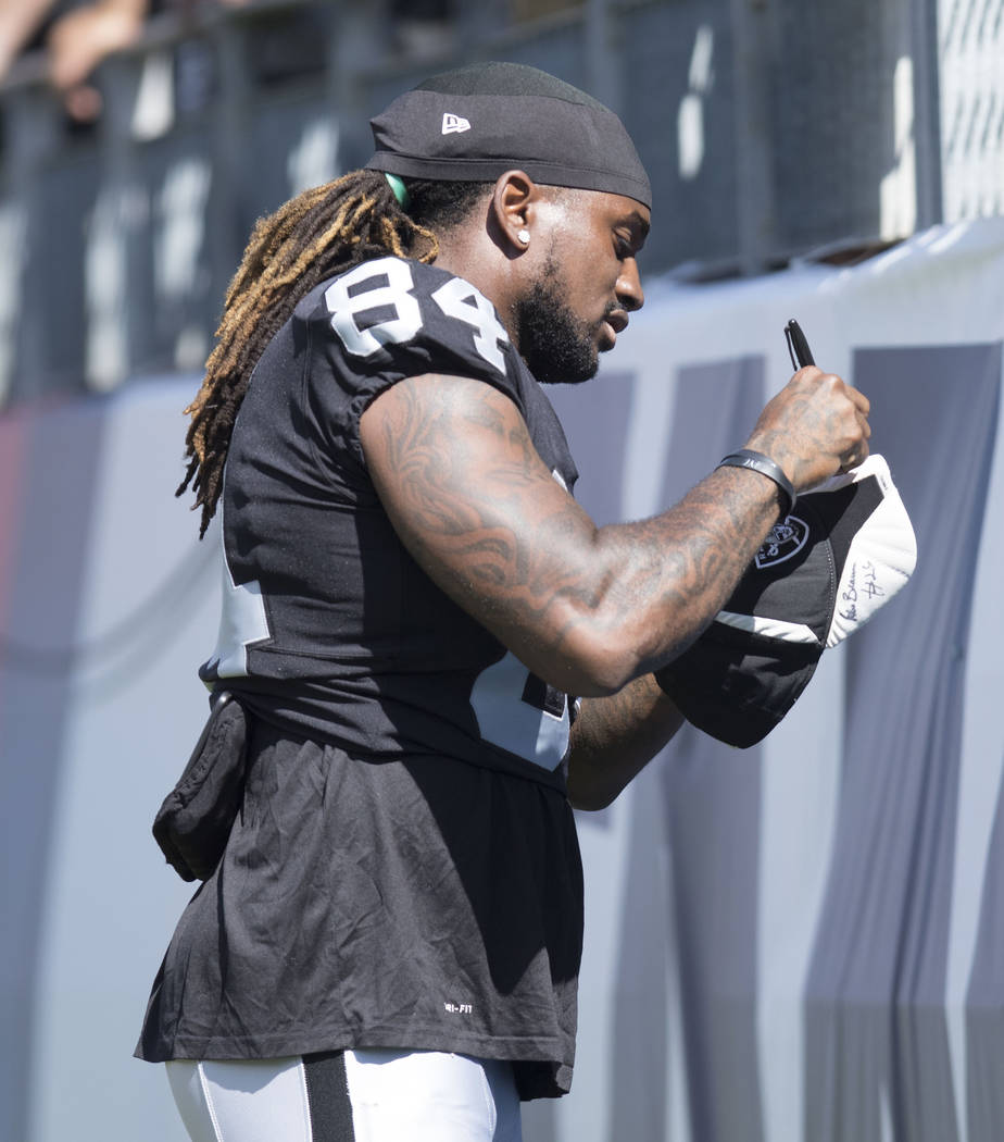 Oakland Raiders wide receiver Cordarrelle Patterson (84) signs autographs before the team's game against the Tennessee Titans at the Nissan Stadium in Nashville, Tenn., Sunday, Sept. 10, 2017. Hei ...