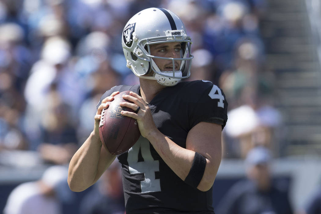 Oakland Raiders quarterback Derek Carr (4) prepares to throw a pass in the first half of the game against the Tennessee Titans at the Nissan Stadium in Nashville, Tenn., Sunday, Sept. 10, 2017. (H ...