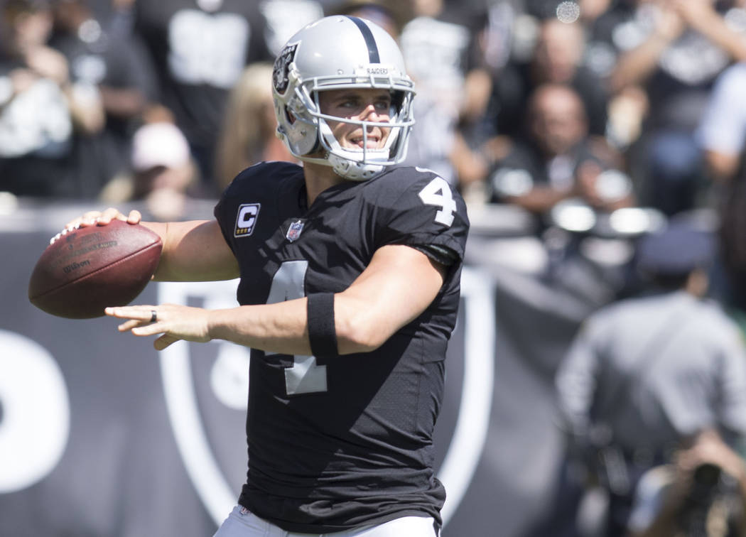 Oakland Raiders quarterback Derek Carr (4) prepares to throw the football in the first half of the game against the New York Jets in Oakland, Calif., Sunday, Sept. 17, 2017. Heidi Fang Las Vegas R ...