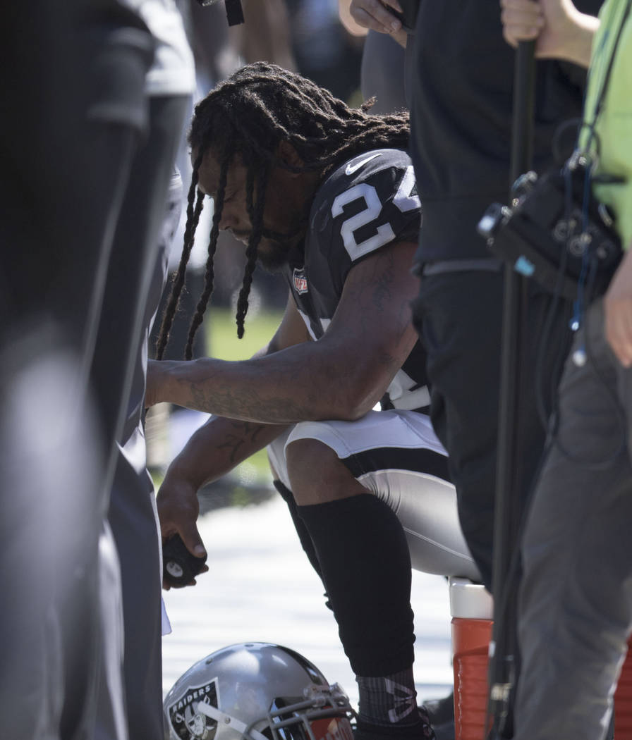 Oakland Raiders running back Marshawn Lynch (24) sits during the national anthem in Oakland, Calif., Sunday, Sept. 17, 2017. Heidi Fang Las Vegas Review-Journal @HeidiFang