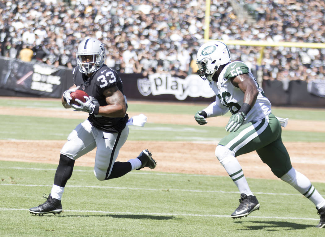 Oakland Raiders running back DeAndre Washington (33) carries the football against the New York Jets in Oakland, Calif., Sunday, Sept. 17, 2017. Heidi Fang Las Vegas Review-Journal @HeidiFang