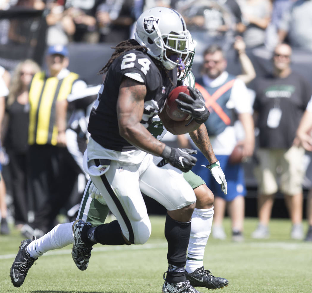 Oakland Raiders running back Marshawn Lynch (24) carries the football in the first half of their game against the New York Jets in Oakland, Calif., Sunday, Sept. 17, 2017. Heidi Fang Las Vegas Rev ...