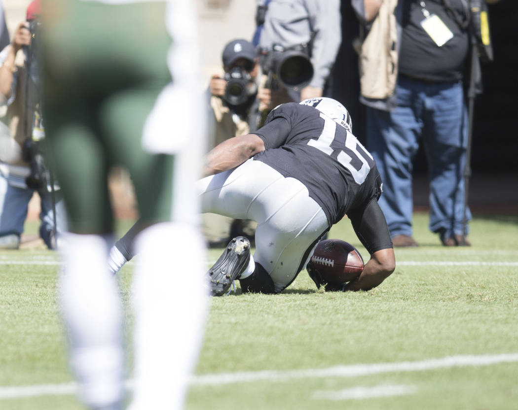 Oakland Raiders wide receiver Michael Crabtree (15) gets in the end zone for a touchdown in the first half of their game against the New York Jets in Oakland, Calif., Sunday, Sept. 17, 2017. Heidi ...