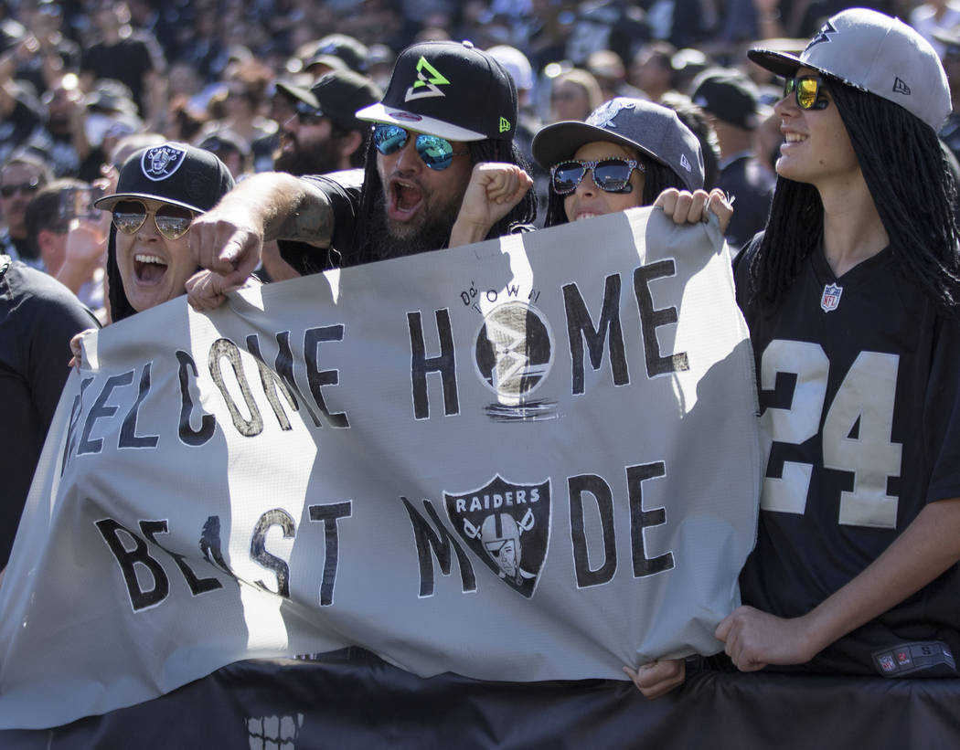 Oakland Raiders fans celebrate a Oakland Raiders running back Marshawn Lynch (24) touchdown in the first half of their game against the New York Jets in Oakland, Calif., Sunday, Sept. 17, 2017. He ...