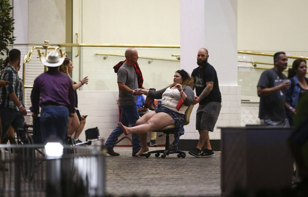 A wounded woman is moved outside of the Tropicana during an active shooter situation on the Las Vegas Stirp in Las Vegas on Sunday, Oct. 1, 2017. Chase Stevens Las Vegas Review-Journal @csstevensphoto
