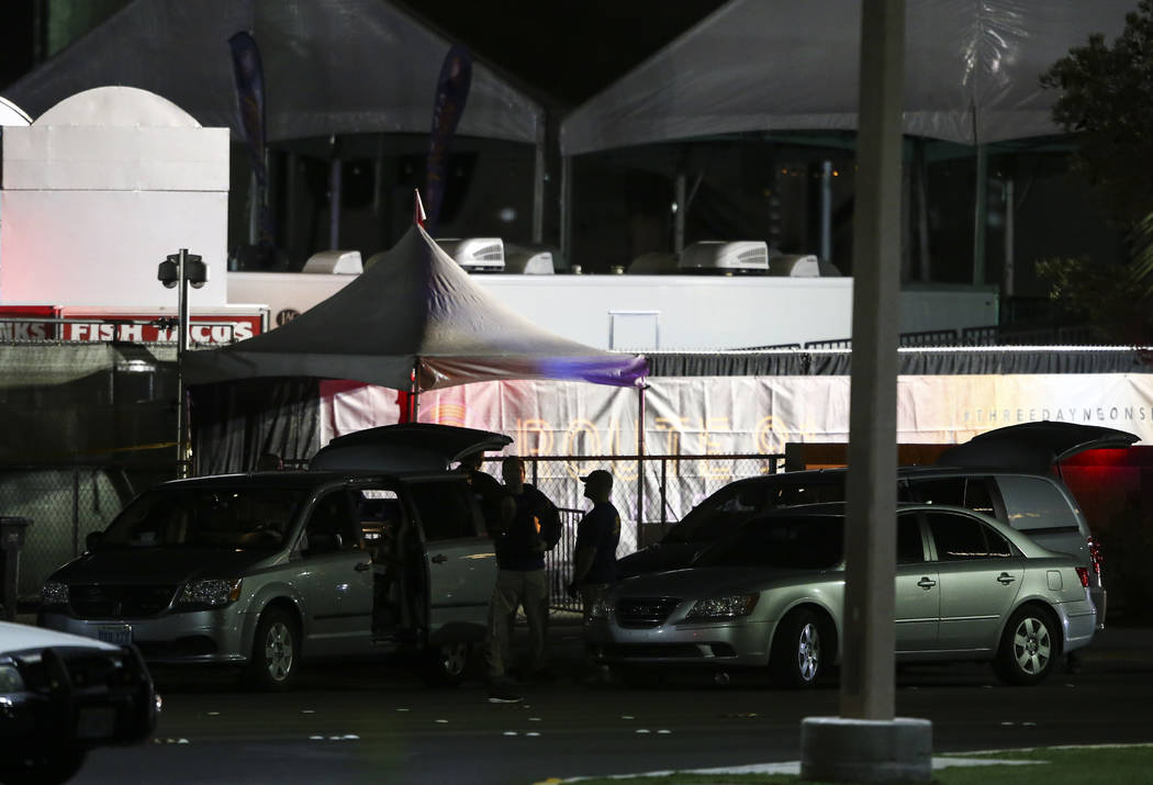 Festival grounds for Route 91 rise in the background as Las Vegas police investigate following an active shooter situation that left 50 dead and over 200 injured on the Las Vegas Strip during the  ...
