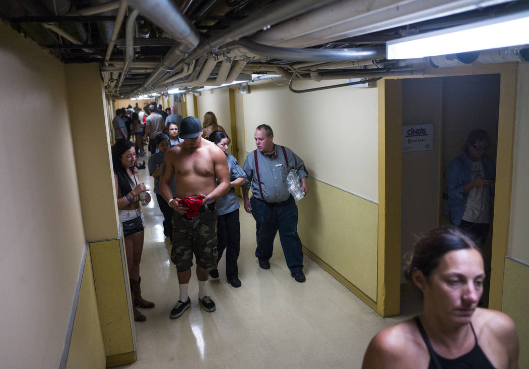 People wait in employee hallways as the Tropicana Las Vegas goes on lockdown during an active shooter situation on the Las Vegas Strip on Sunday, Oct. 1, 2017. Chase Stevens Las Vegas Review-Journ ...